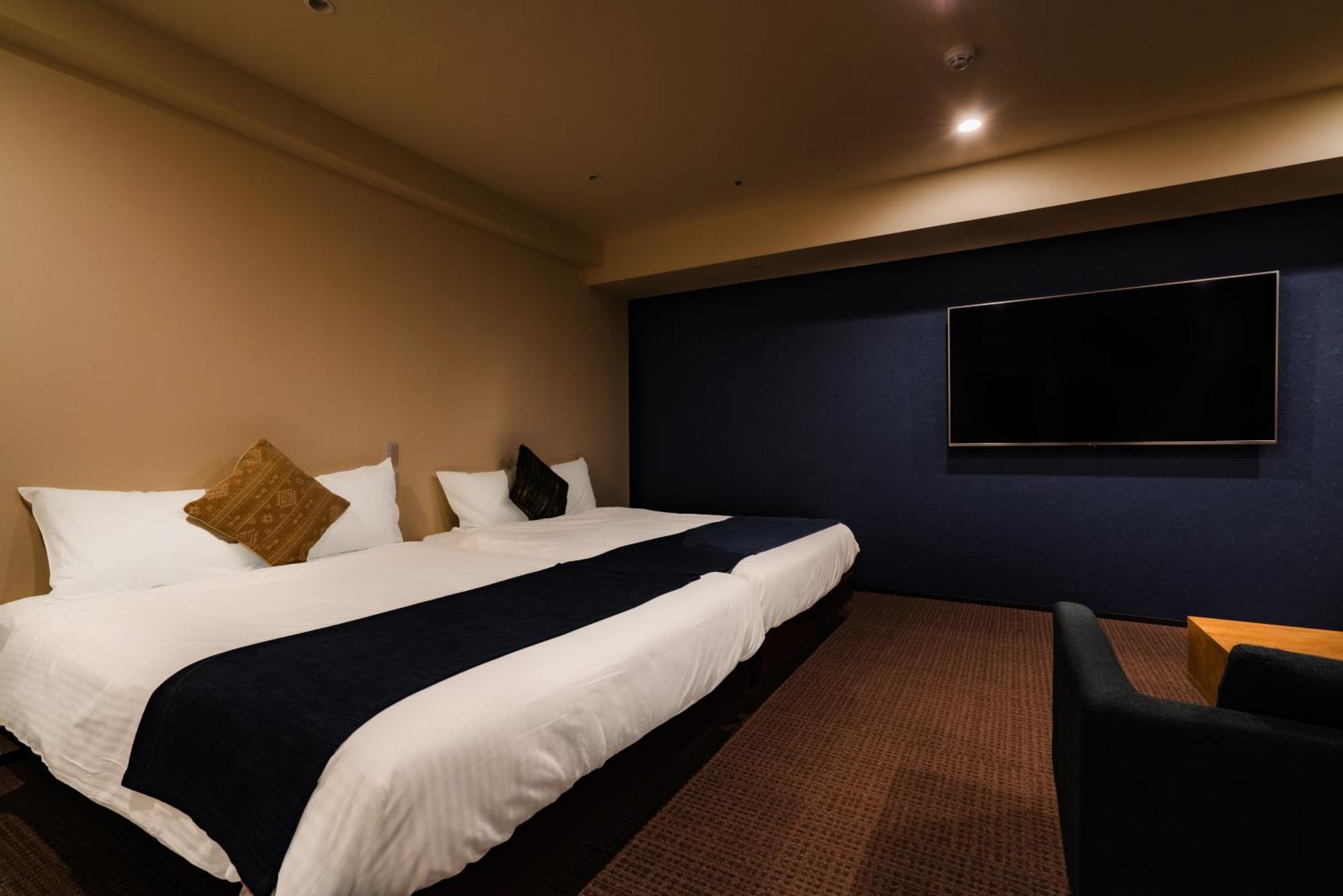 Randor Hotel Sapporo Suites Ruang foto A room at the hotel