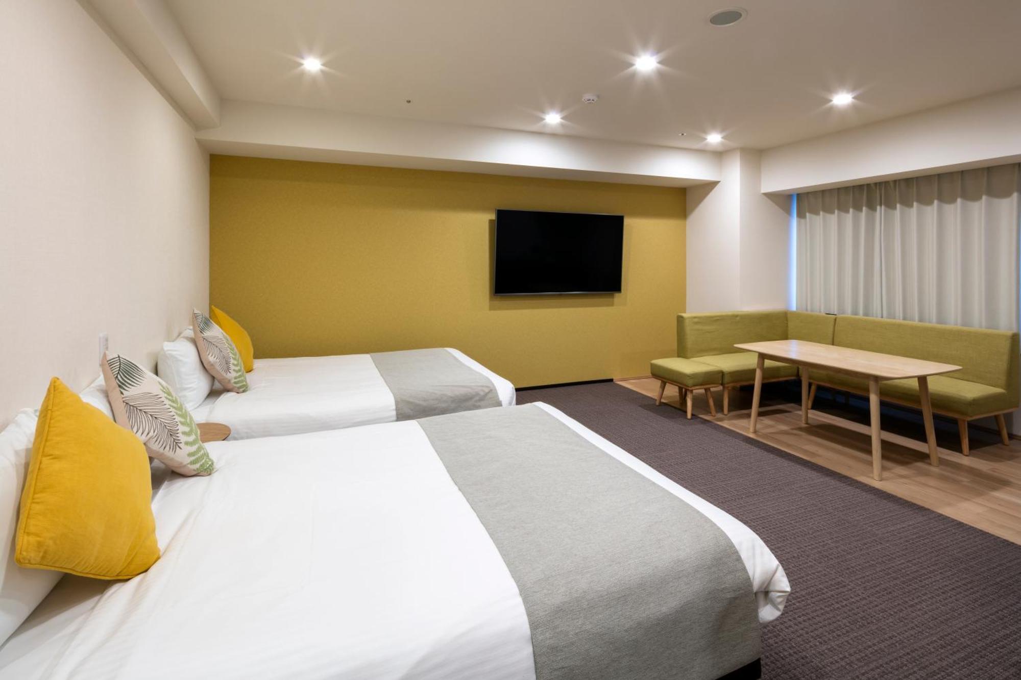 Randor Hotel Sapporo Suites Ruang foto A room at the hotel