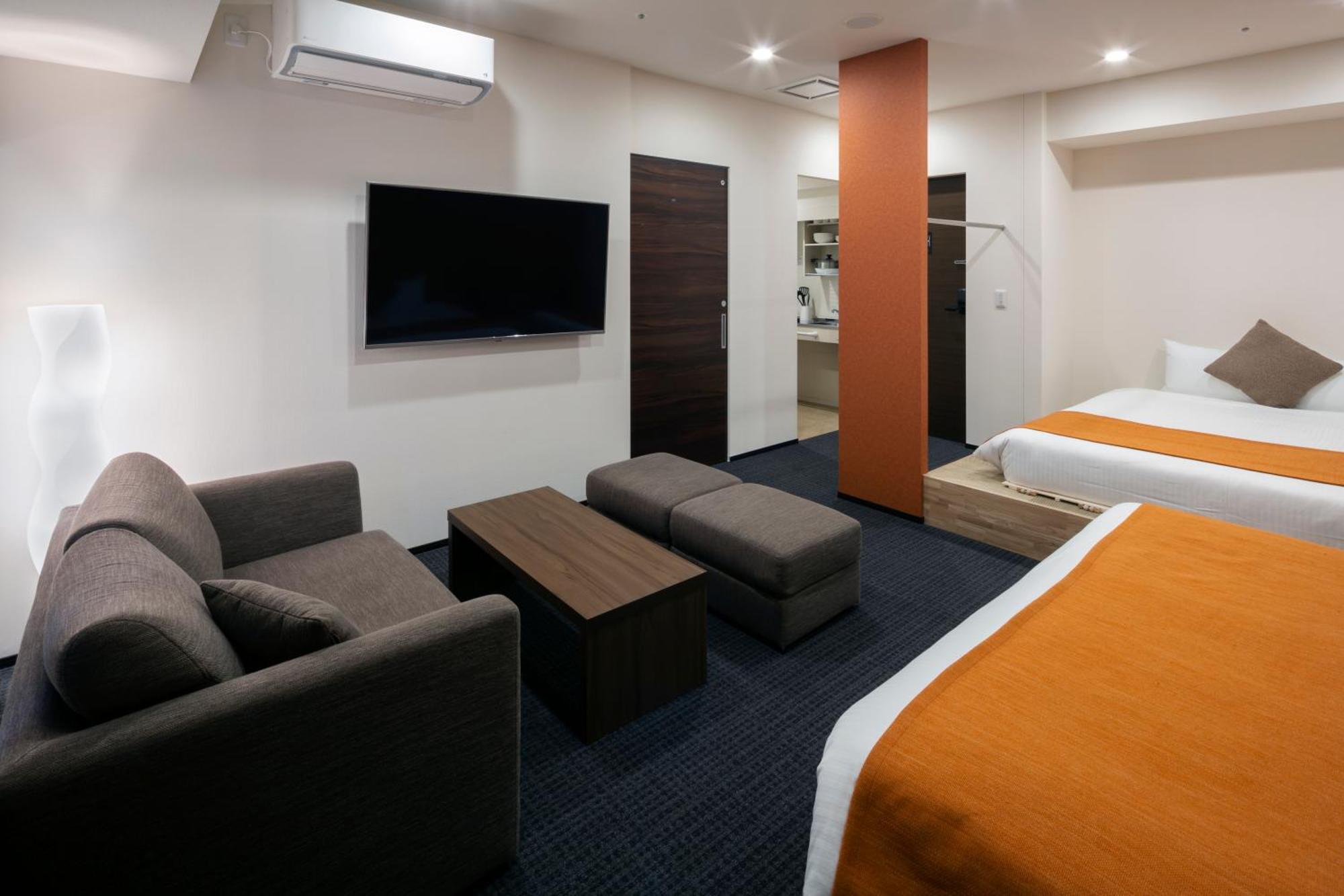 Randor Hotel Sapporo Suites Ruang foto A room at the hotel