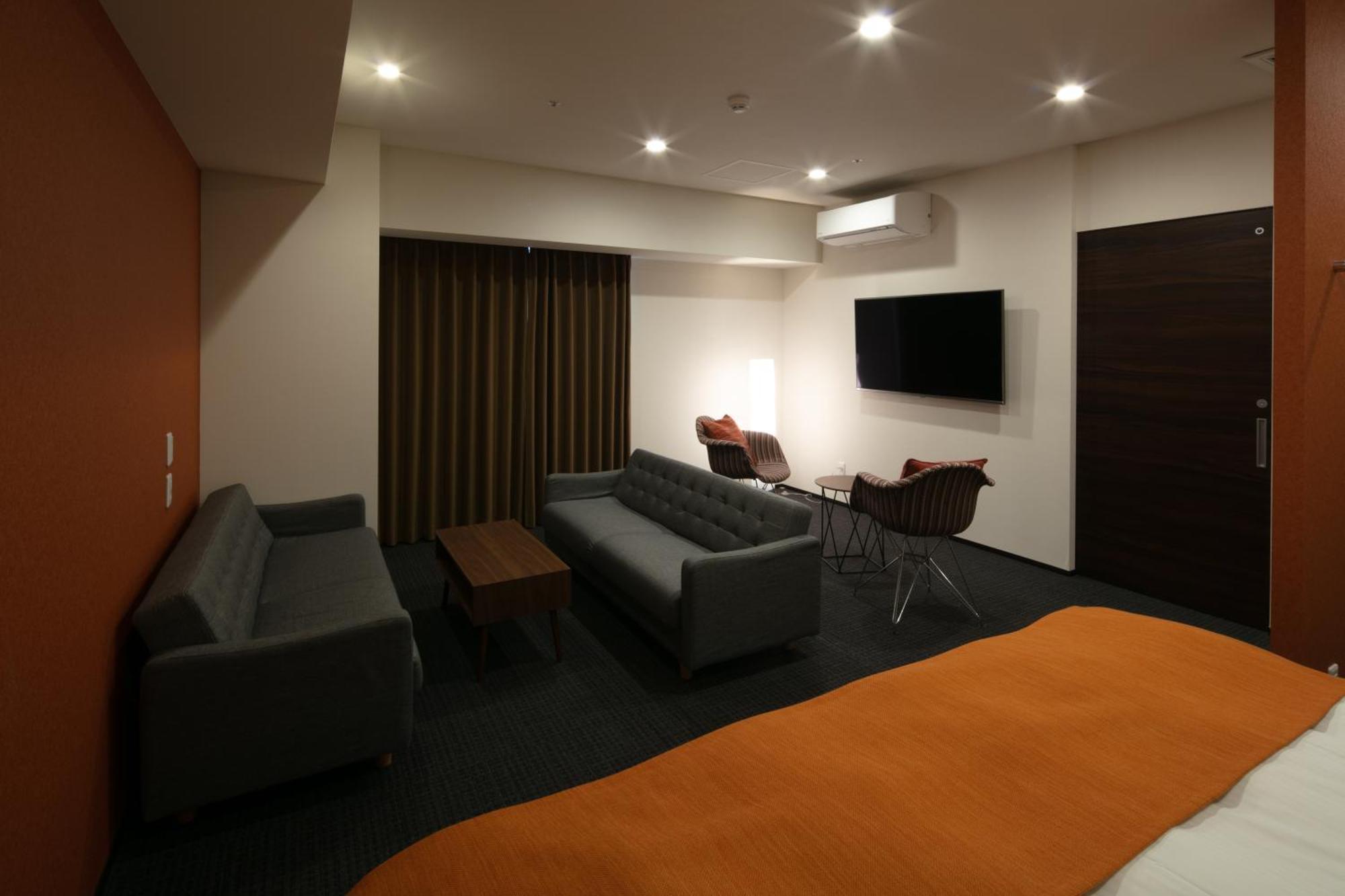 Randor Hotel Sapporo Suites Ruang foto A room at the hotel